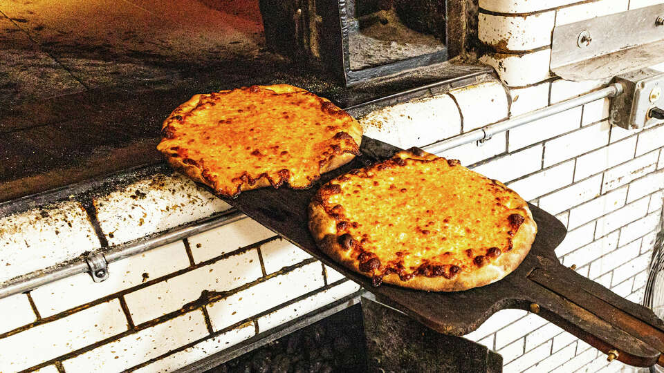 Employees make pizza at Frank Pepe Pizzeria Napoletana in New Haven on Nov. 6, 2024.