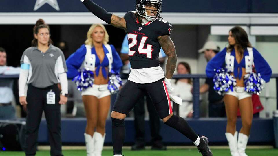 Houston Texans cornerback Derek Stingley Jr. (24) smiles after intercepting a pass by Dallas Cowboys quarterback Cooper Rush during the first half of an NFL football game at AT&T Stadium, Monday, Nov. 18, 2024, in Arlington.