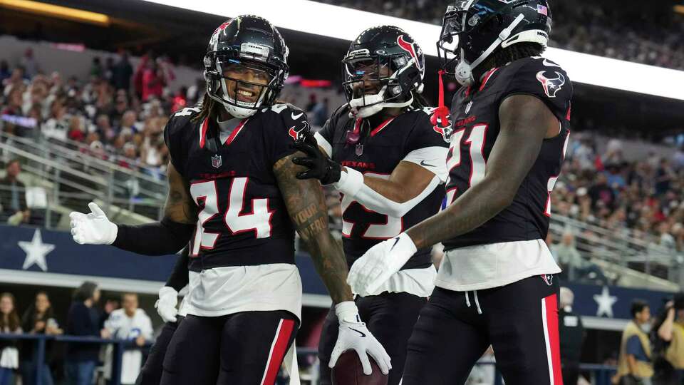 Houston Texans cornerback Derek Stingley Jr. (24) smiles after intercepting a pass by Dallas Cowboys quarterback Cooper Rush during the first half of an NFL football game at AT&T Stadium, Monday, Nov. 18, 2024, in Arlington.