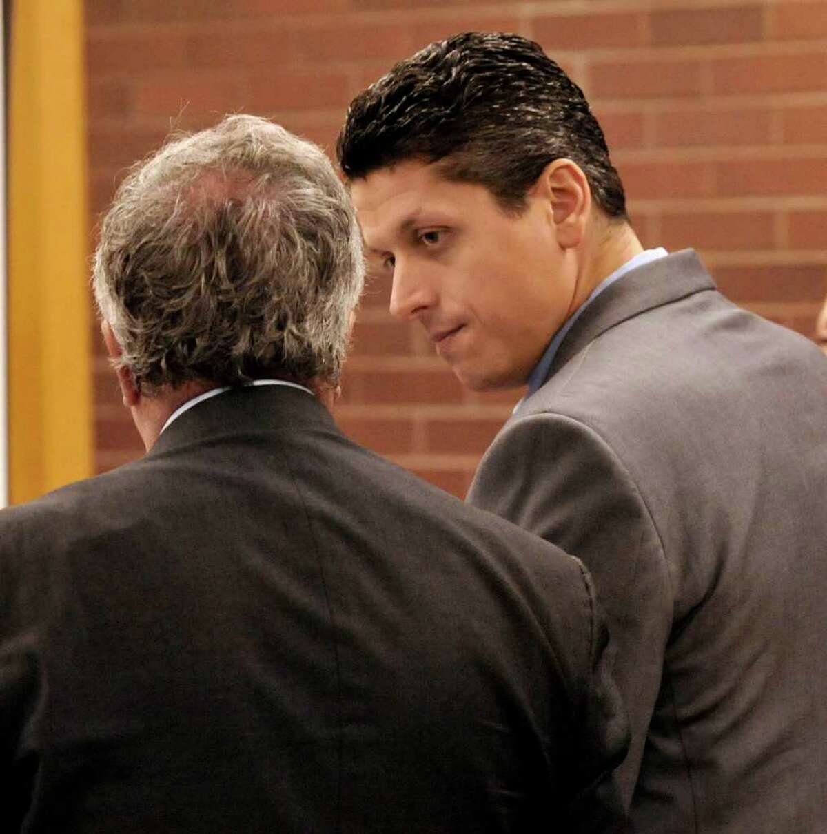 Marash Gojcaj confers with his attorney, Mickey Sherman, in Superior Court in Danbury, Wednesday, Sept. 29, 2010.