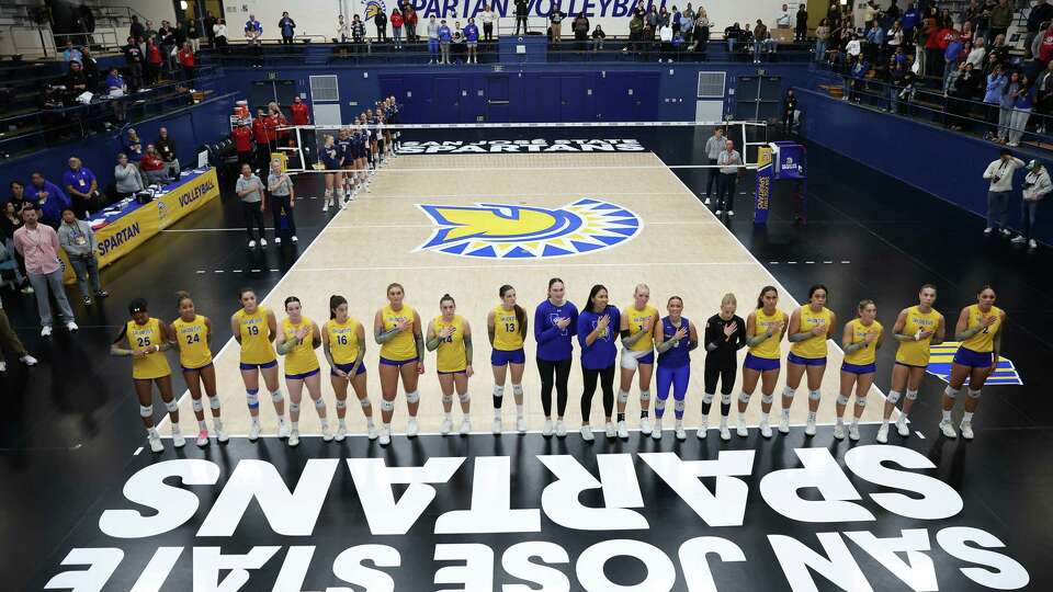 San José State University women’s volleyball team stands for National Anthem before match against Fresno State at Yosh Ushida/Spartan Gym in San Jose, Calif., on Tuesday, November 19, 2024.