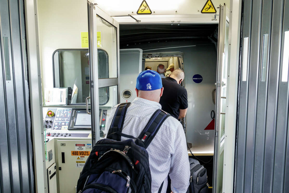 Miami, Florida, Miami International Airport MIA terminal, flight departure passengers boarding airplane. 