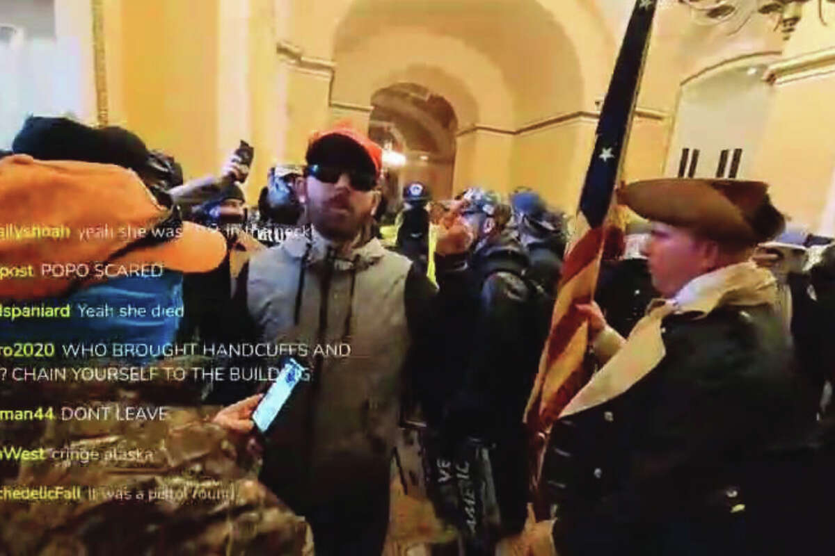 According to video footage obtained by the FBI, the defendant, Daniel Goodwyn, entered the Capitol Building on January 6, 2021. Goodwyn was wearing dark sunglasses, a MAGA hat, and a tan and black jacket.