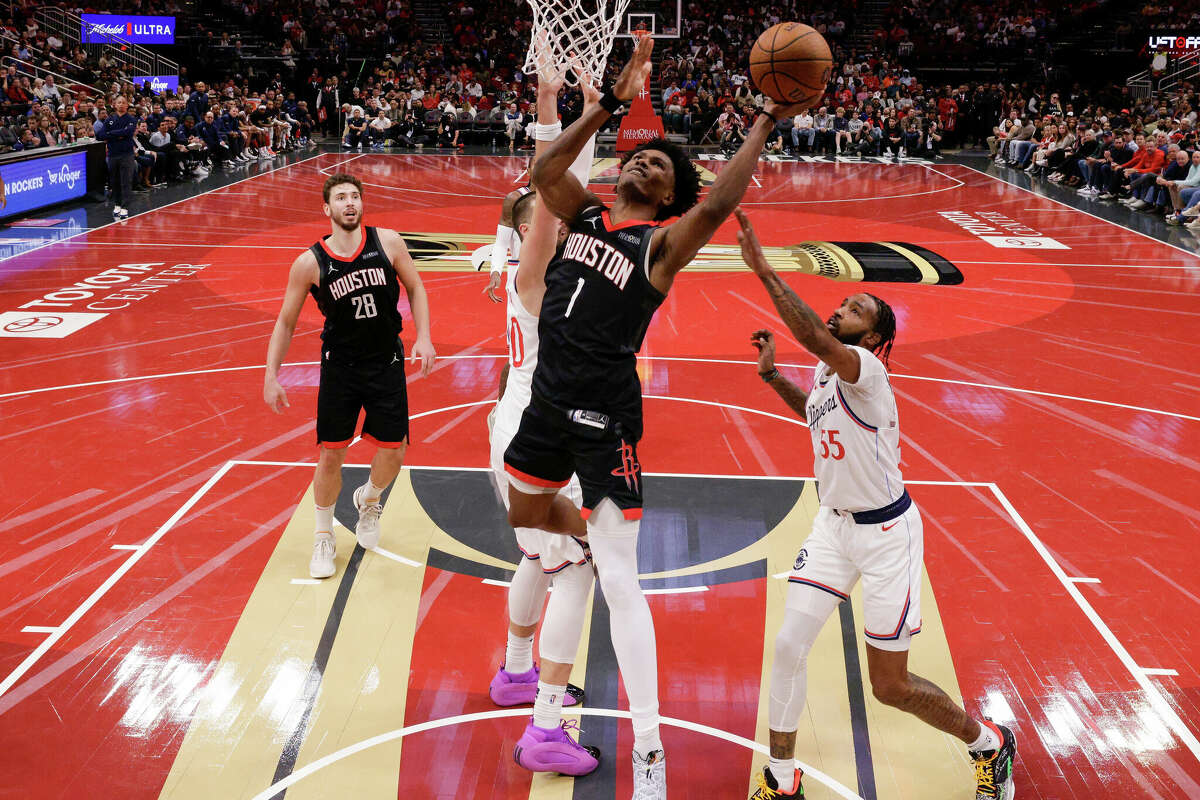 Amen Thompson #1 of the Houston Rockets goes up for a lay up against Derrick Jones Jr. #55 of the Los Angeles Clippers in the second half during the Emirates NBA Cup game at Toyota Center on November 15, 2024 in Houston, Texas. 