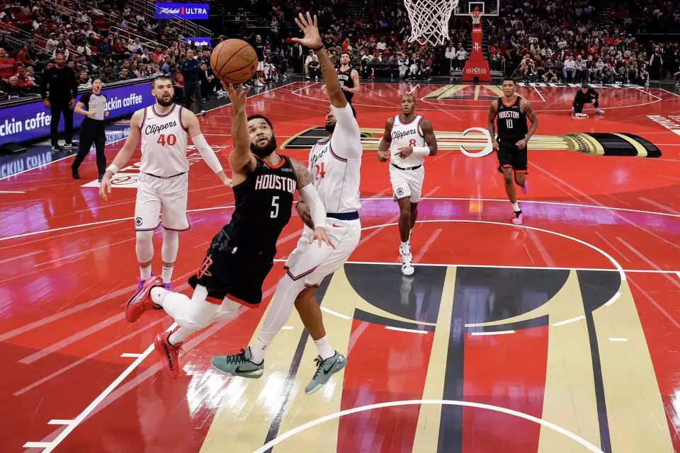 Fred VanVleet #5 of the Houston Rockets goes up for a lay up against Norman Powell #24 of the Los Angeles Clippers in the second half during the Emirates NBA Cup game at Toyota Center on November 15, 2024 in Houston, Texas.u00a0