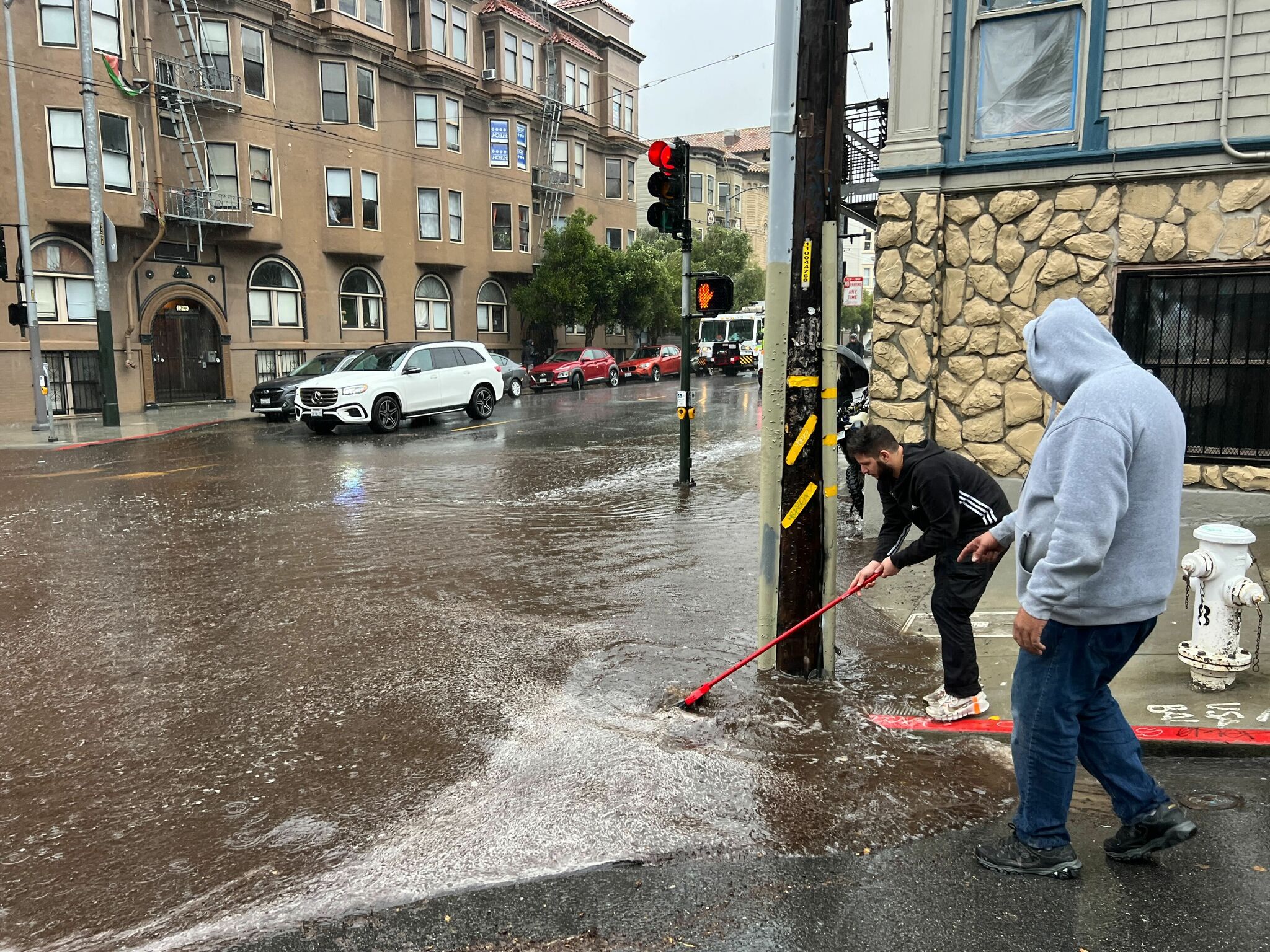 San Francisco roads flood as city pounded by intense band of rain