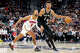 Golden State Warriors forward Kyle Anderson (1) tries to steal the ball from San Antonio Spurs center Victor Wembanyama (1) during the second half of their NBA game at the Frost Bank Center on Saturday, Nov. 23, 2024 in San Antonio. The Spurs beat the Warriors 104-94.