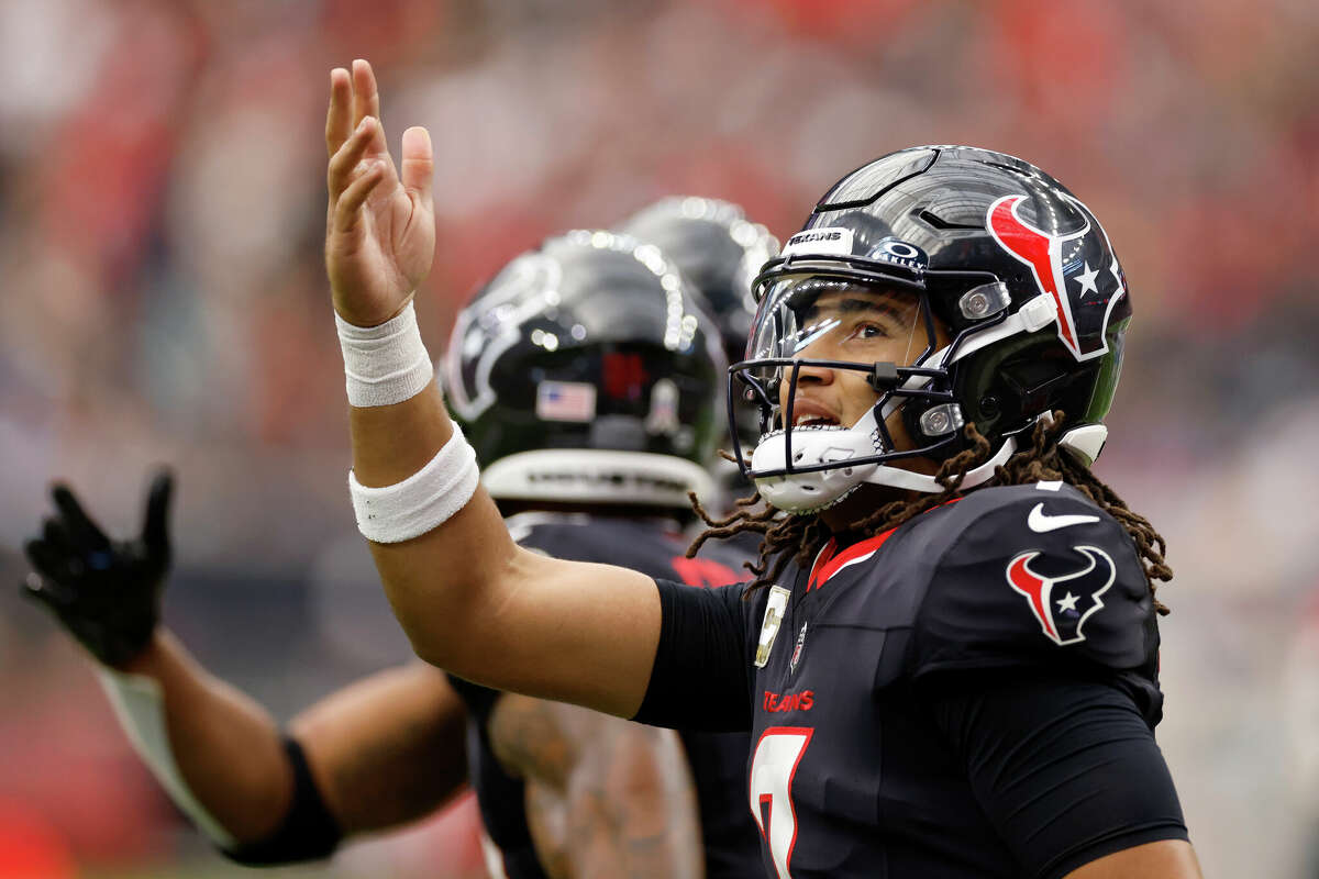 C.J. Stroud #7 of the Houston Texans reacts after throwing a touchdown pass against the Tennessee Titans during the second quarter at NRG Stadium on November 24, 2024 in Houston, Texas