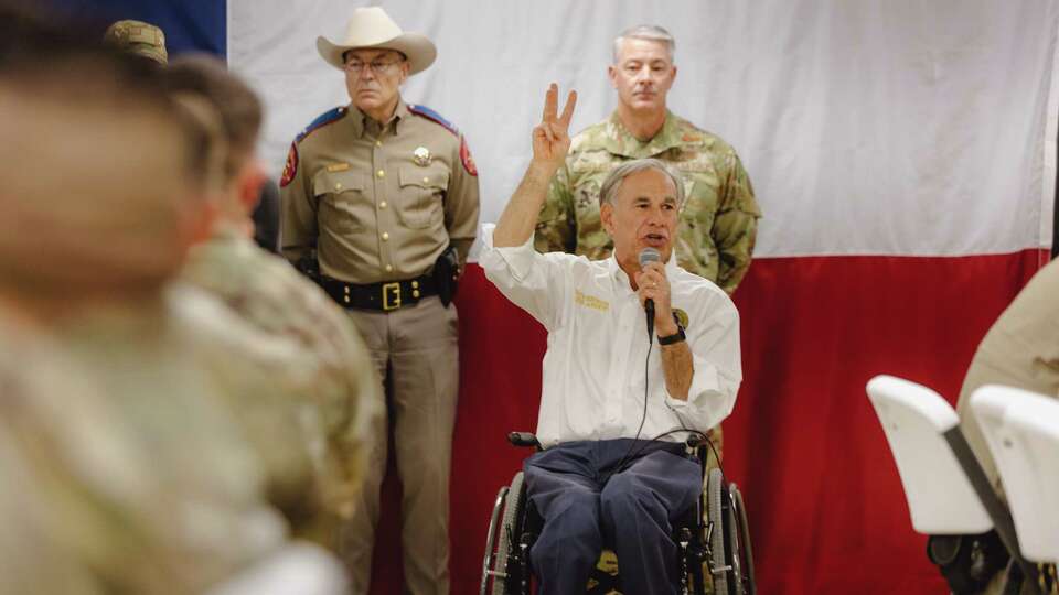 Texas Governor Greg Abbott and incoming Border Czar Tom Homan make remarks at a Thanksgiving lunch event at Forward Operating Base Eagle, a newly built military base serving Operation Lone Star near the Rio Grande River on Tues, Nov. 26, 2024, in Eagle Pass, Texas.