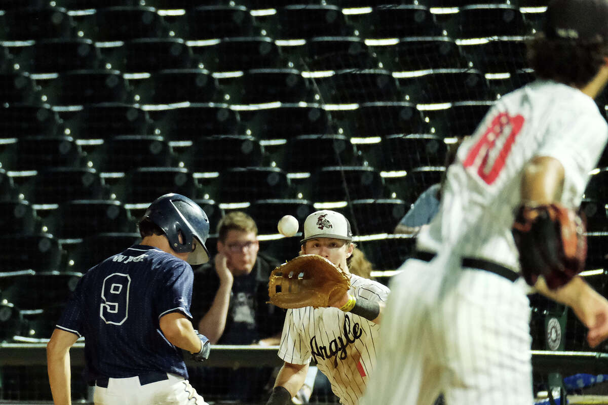 Boerne Champion #9 Rowdy Miller makes it safely back to first before Argyle #1 GRady Emerson can tag him in the 5A state baseball semifinal at the Dell Diamond in Round Rock, TX June 8, 2023. This is Champion's state-tournament debut for baseball.