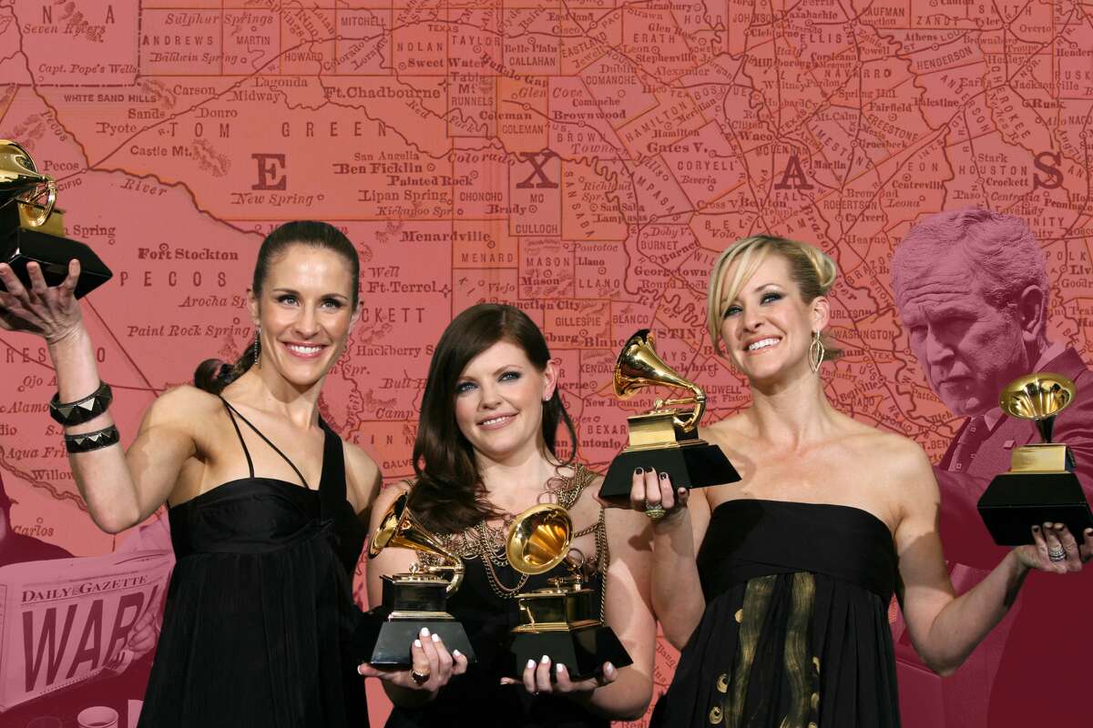 The Chicks holding their Grammys for 'Not Ready to Make Nice' and Taking the Long Way. 