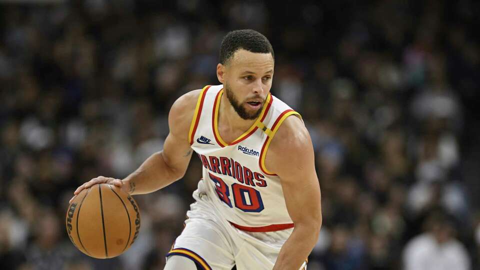 Golden State Warriors' Stephen Curry runs upcourt during an NBA basketball game against the San Antonio Spurs, Saturday, Nov. 23, 2024, in San Antonio. (AP Photo/Darren Abate)