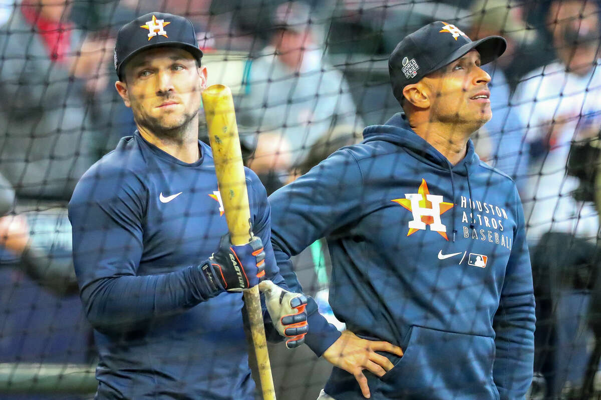 Houston Astros third baseman Alex Bregman (2) waits next to bench coach Joe Espada (19) during batting practice before Game 5 of the World Series on Sunday, Oct. 31, 2021 at Truist Park in Atlanta.