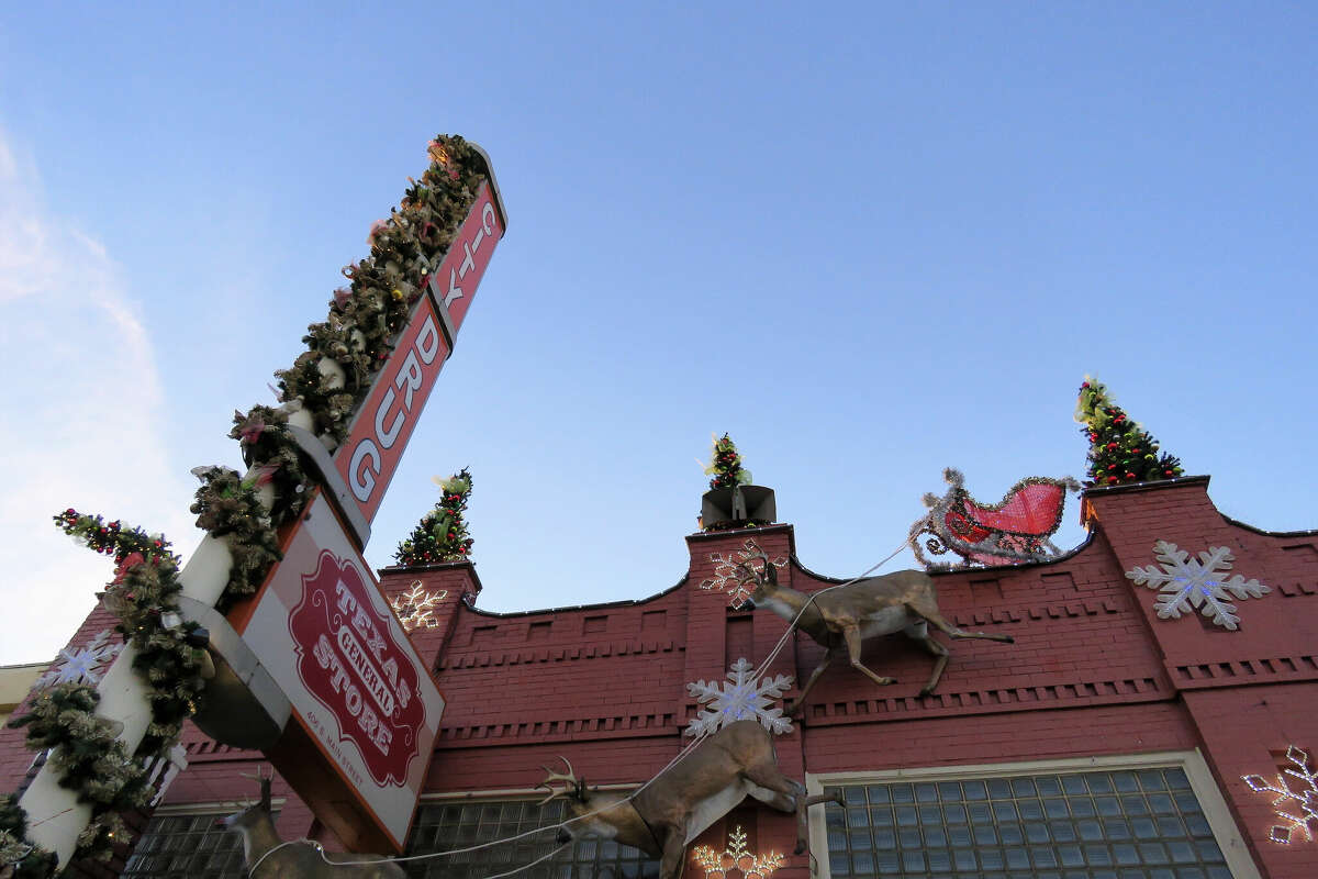 Santa's sleigh and a reindeer display sit atop a drugstore on Main Street in downtown Grapevine, a suburb city of Fort Worth and Dallas, Texas.