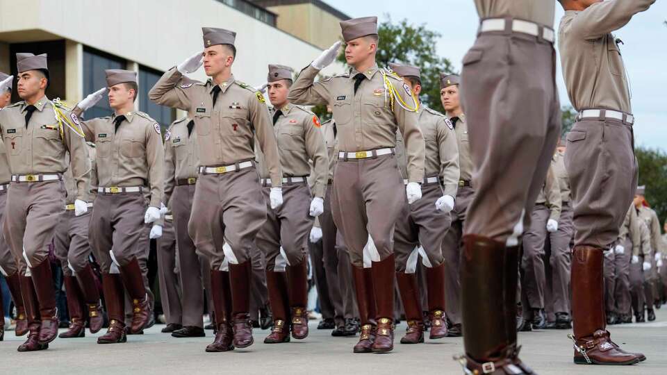 The Texas A&M Corps of Cadets march to the stadium before an NCAA college football game against Texas at Kyle Field, Saturday, Nov. 30, 2024, in College Station.