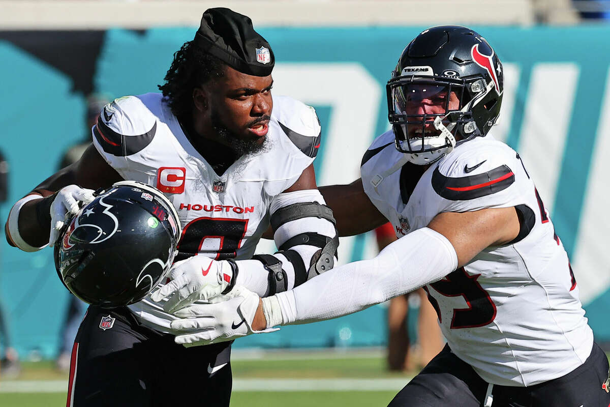 JACKSONVILLE, FLORIDA - DECEMBER 01: Azeez Al-Shaair #0 of the Houston Texans takes off his helmet before a fight during the second quarter of a game against the Jacksonville Jaguars at EverBank Stadium on December 01, 2024 in Jacksonville, Florida. (Photo by Mike Carlson/Getty Images)