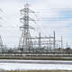 Power lines are shown near Beltway 8 the Hardy Toll Road following an overnight snowfall Monday, Feb. 15, 2021 in Houston.