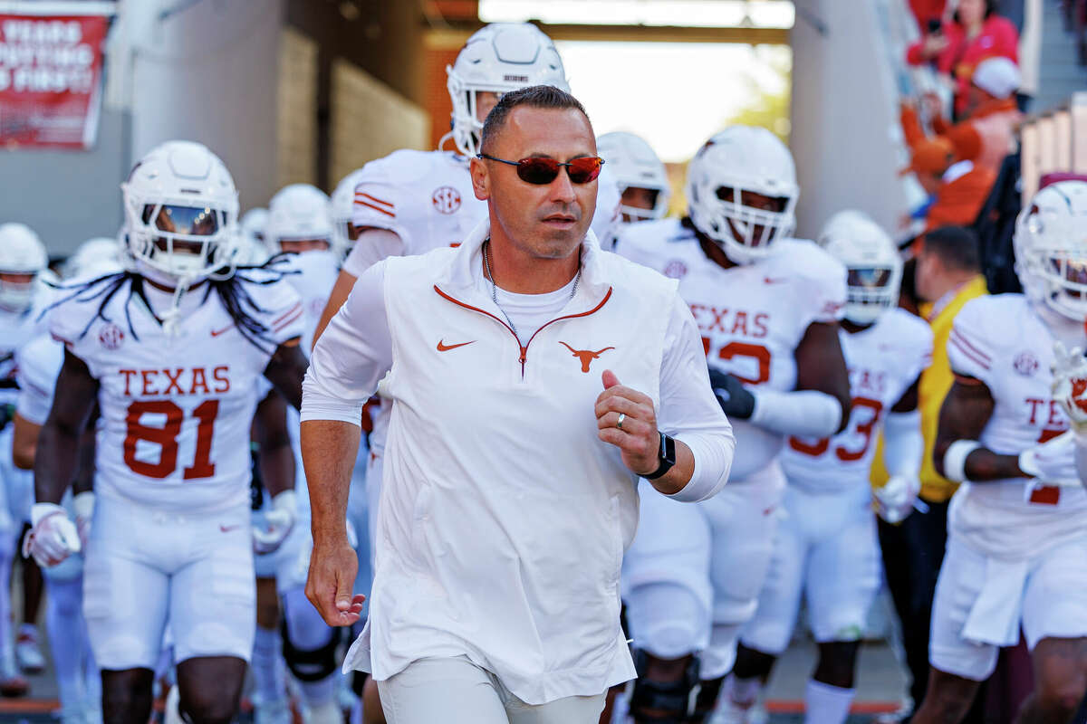 FAYETTEVILLE, ARKANSAS - NOVEMBER 16: Head Coach Steve Sarkisian of the Texas Longhorns leads his team onto the field during a game against the Arkansas Razorbacks at Donald W. Reynolds Razorback Stadium on November 16, 2024 in Fayetteville, Arkansas. The Longhorns defeated the Razorbacks 20-10. (Photo by Wesley Hitt/Getty Images)