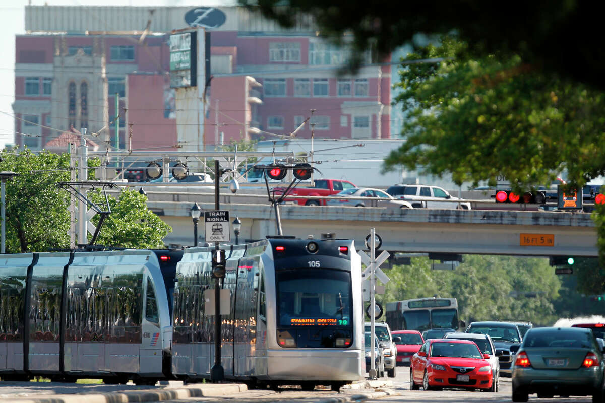 Metro Rail train heads north along Main Street as it passes the Highway 59 during rush hour on Wednesday, April 18, 2012, in Houston. According to a survey, Houstonians are more interested in mass transit than expanding highways. ( Mayra Beltran / Houston Chronicle ) (Photo by Mayra Beltran/Houston Chronicle via Getty Images)