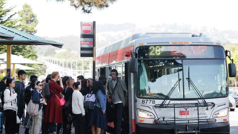 Students and others line up to board a Muni 29 bus along 19th Avenue outside San Francisco State University on Monday, September 16, 2024 in San Francisco, Calif.