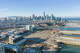 An aerial view of Mission Bay and new Mission Rock development with the San Francisco skyline in the background.