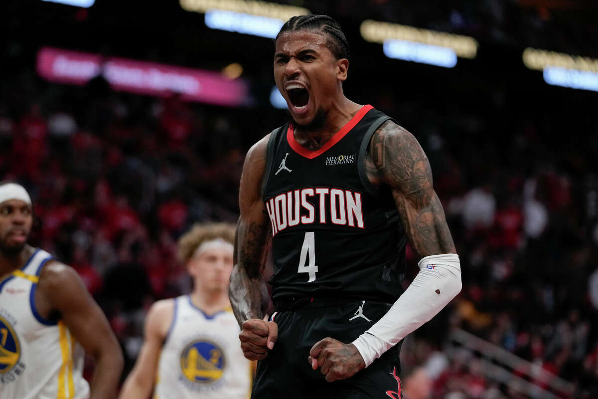 Houston Rockets guard Jalen Green celebrates after a dunk during the first half of an Emirates NBA cup tournament quarterfinal basketball game against the Golden State Warriors in Houston, Wednesday, Dec. 11, 2024. 