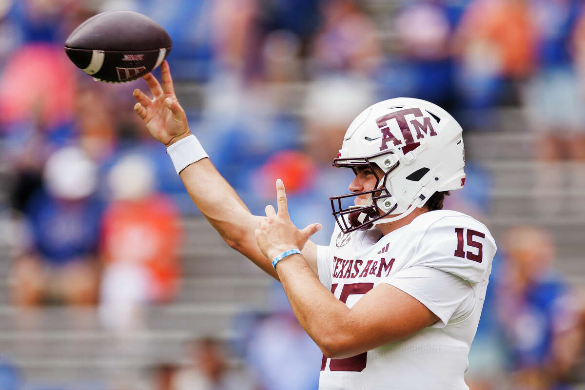 GAINESVILLE, FLORIDA - SEPTEMBER 14: Conner Weigman #15 of the Texas A&M Aggies warms up before the start of a game against the Florida Gators at Ben Hill Griffin Stadium on September 14, 2024 in Gainesville, Florida. (Photo by James Gilbert/Getty Images)