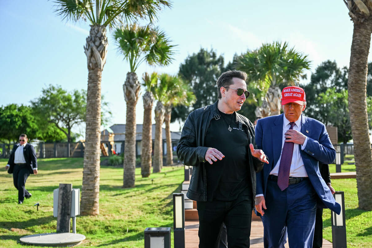 Elon Musk greets U.S. President-elect Donald Trump as he arrives to attend a viewing of the launch of the sixth test flight of the SpaceX Starship rocket on November 19, 2024 in Brownsville, Texas. 