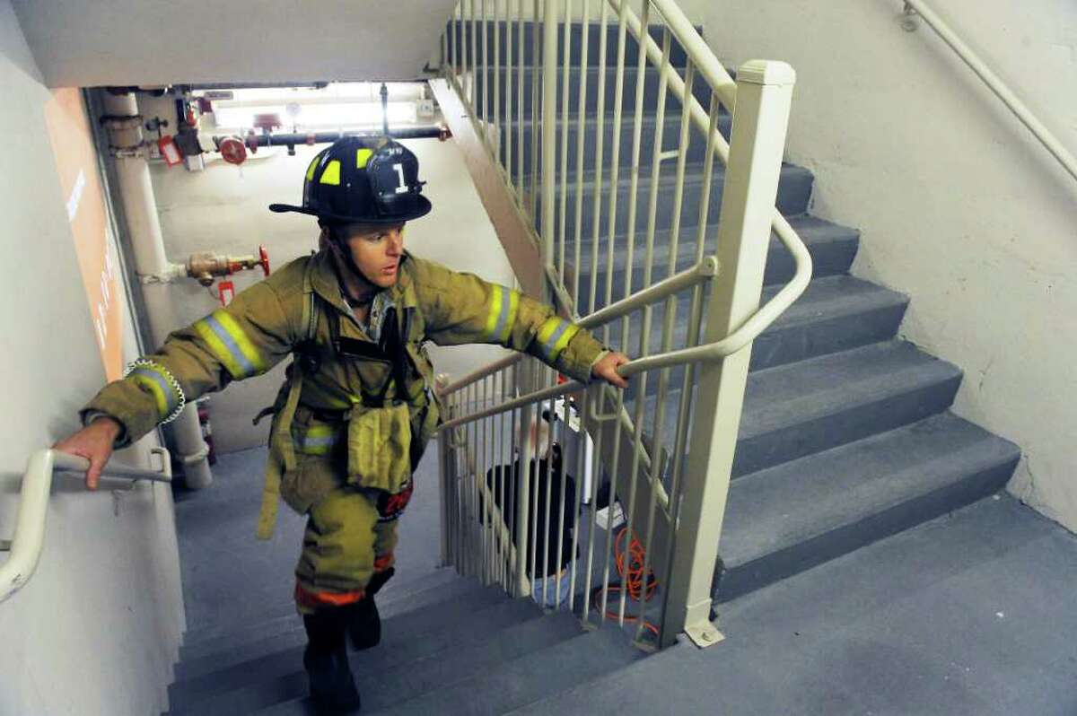 Stamford firefighter Alan Hagander runs up the first flight of stairs in the "Fight for Air" Climb to benefit the American Lung Association at Trump Parc in Stamford, Conn. on Saturday November 6, 2010.