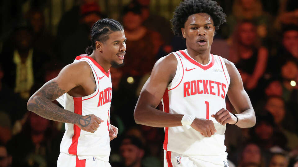 Houston Rockets guard Jalen Green, left, and forward Amen Thompson (1) celebrate after Thompson made a basket while being fouled during the first half of a semifinal game against the Oklahoma City Thunder in the NBA Cup basketball tournament Saturday, Dec. 14, 2024, in Las Vegas. (AP Photo/Ian Maule)