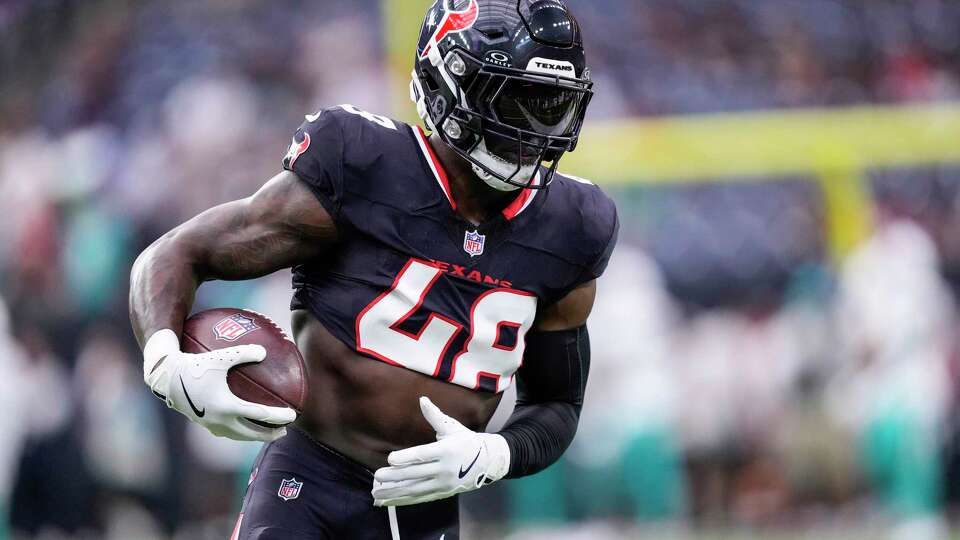 Houston Texans linebacker Christian Harris (48) runs with the ball as he gets ready for an NFL football game against the Miami Dolphins on Sunday, Dec. 15, 2024, in Houston. Harris returned to the field Sunday after being on injured reserve.