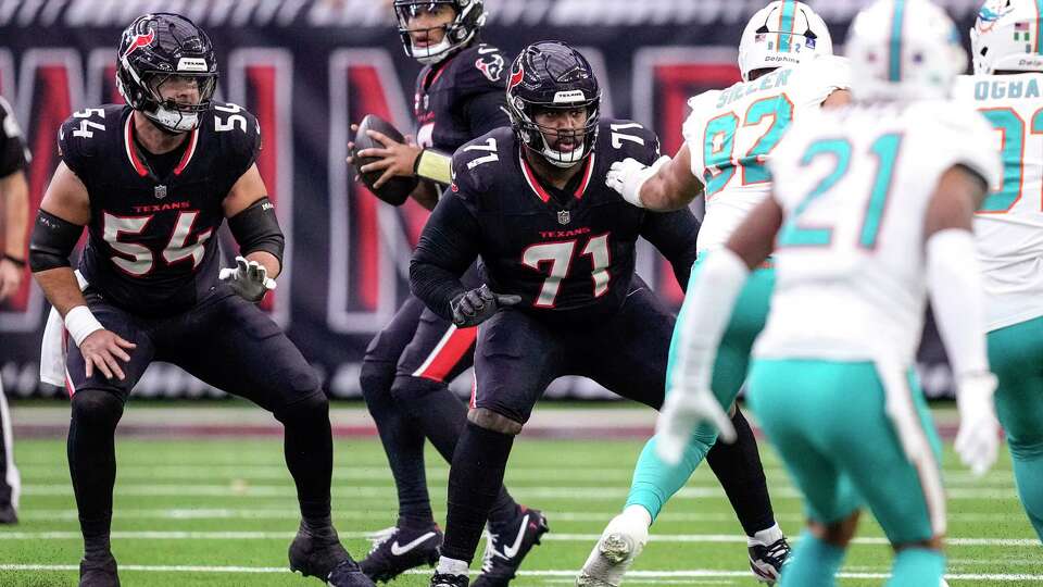 Houston Texans center Jarrett Patterson (54) and guard Tytus Howard (71) drop back into pass protection in front of quarterback C.J. Stroud (7) during the first half of an NFL football game against the Miami Dolphins Sunday, Dec. 15, 2024, in Houston. Howard moved to left guard from the right tackle position against the Dolphins.