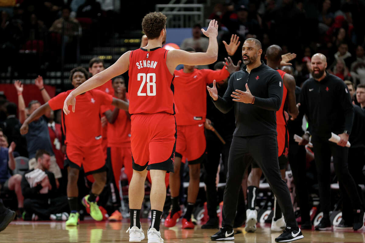 HOUSTON, TEXAS - NOVEMBER 12: Alperen Sengun #28 of the Houston Rockets is congratulated by head coach Ime Udoka in the second half against the Denver Nuggets at Toyota Center on November 12, 2023 in Houston, Texas. NOTE TO USER: User expressly acknowledges and agrees that, by downloading and or using this photograph, User is consenting to the terms and conditions of the Getty Images License Agreement. (Photo by Tim Warner/Getty Images)