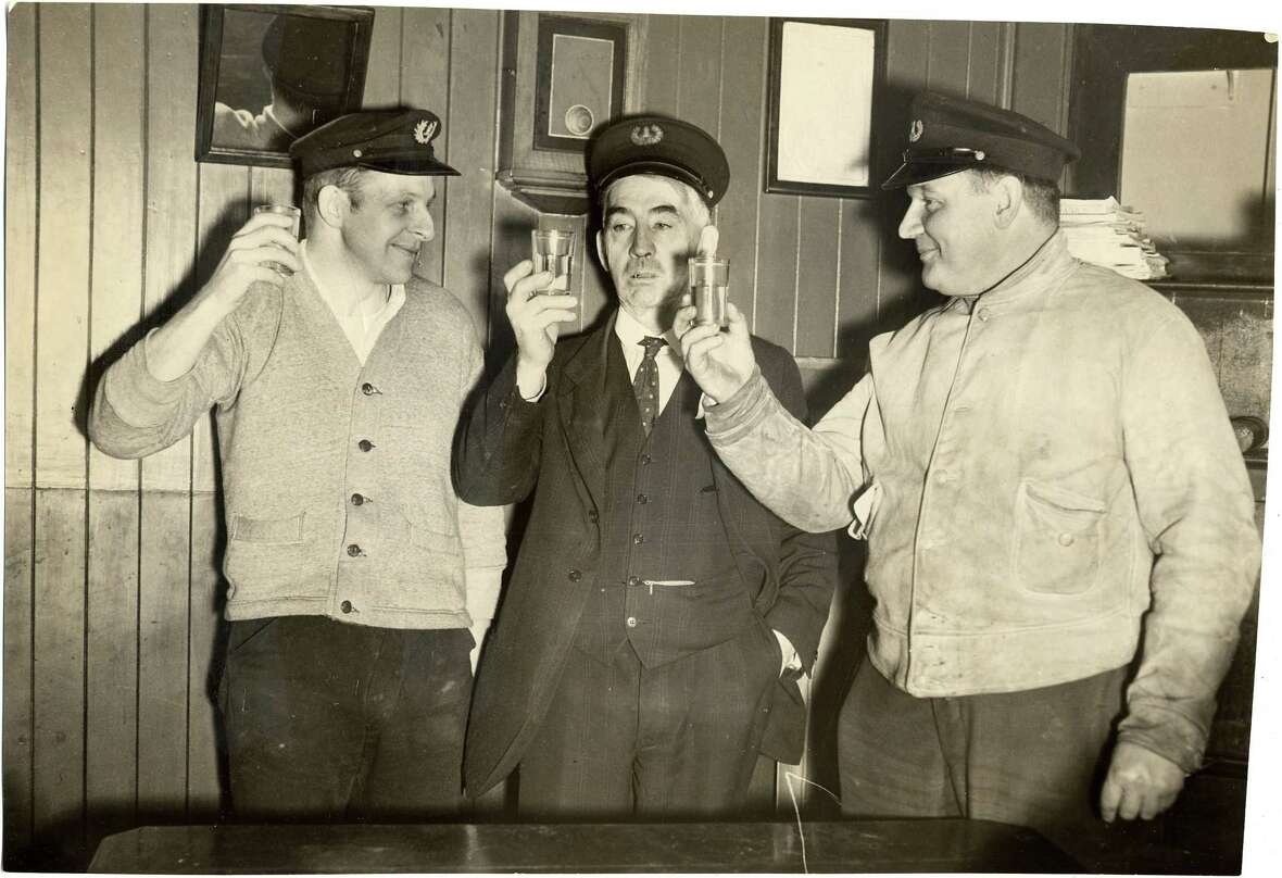 Lighthouse keepers at Mile Rock Lighthouse have a drink to celebrate the end of Prohibition in 1933.