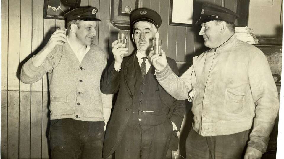 Lighthouse keepers at Mile Rock Lighthouse have a drink to celebrate the end of Prohibition in 1933.