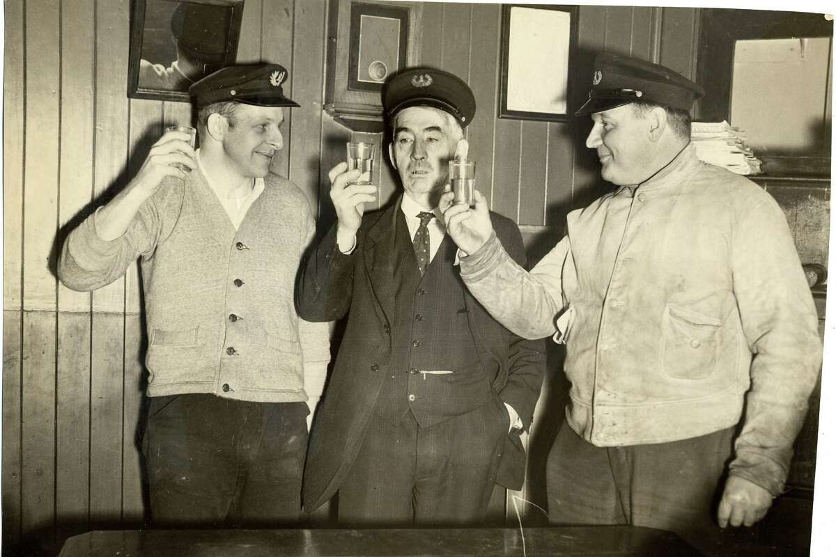 Lighthouse keepers at Mile Rock Lighthouse have a drink to celebrate the end of Prohibition in 1933.