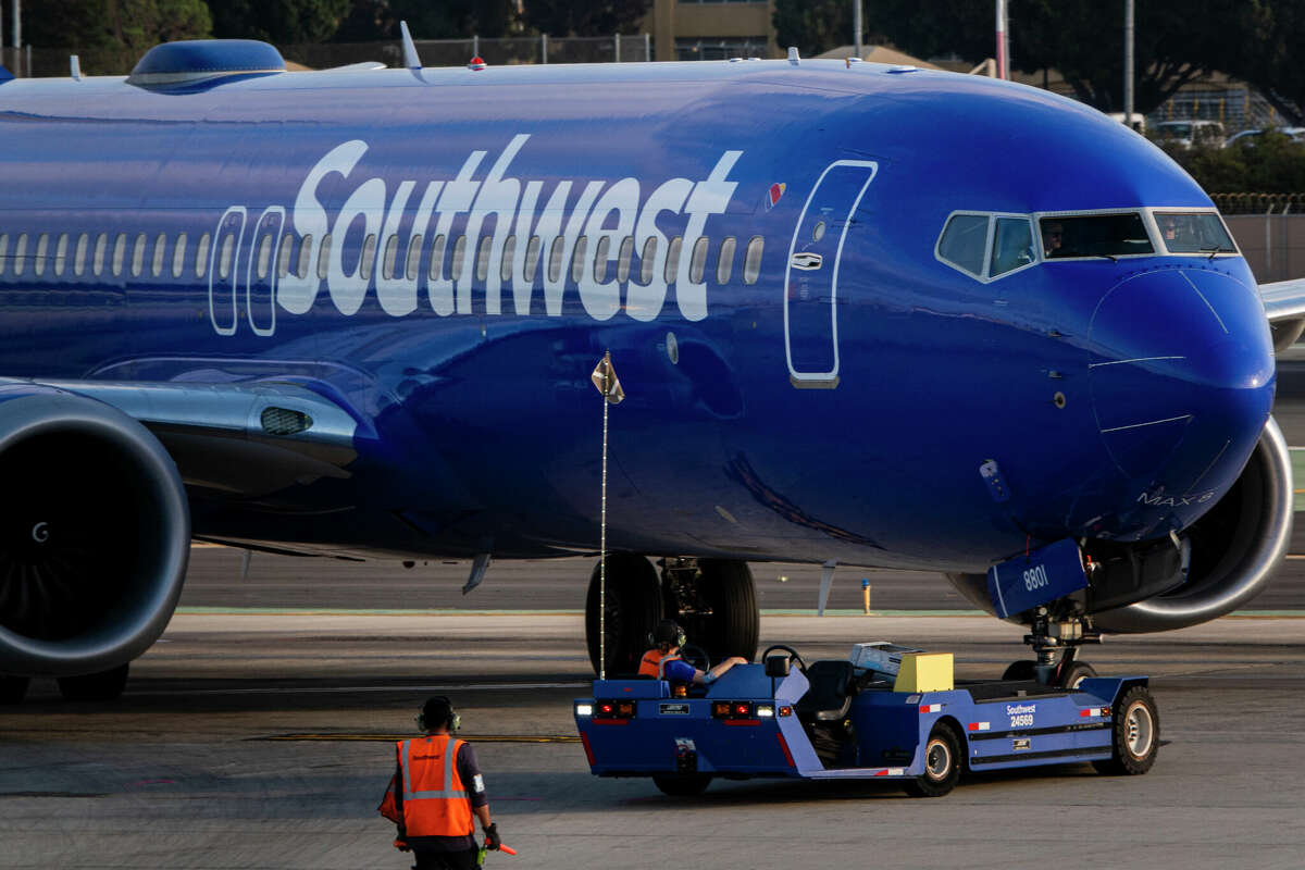 A Southwest Airlines Boeing 737 MAX is pushed back from the gate at San Diego International Airport en route to Denver on August 24, 2024 in San Diego, California. 