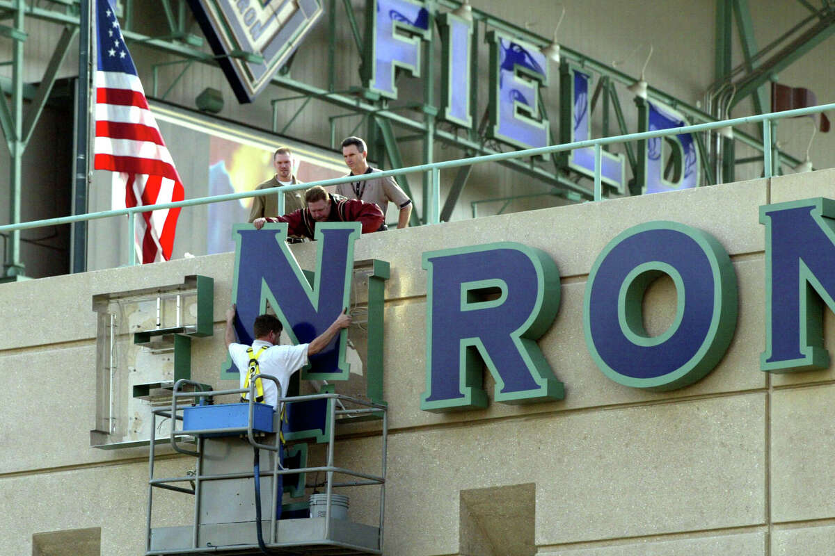 Stadium employees remove letters from one of the Enron Field signs March 21, 2002 in Houston, TX. The Houston Astros paid $2.1 million to get back the naming rights to their stadium from collasped energy trader Enron. (Photo by James Nielsen/Getty Images)