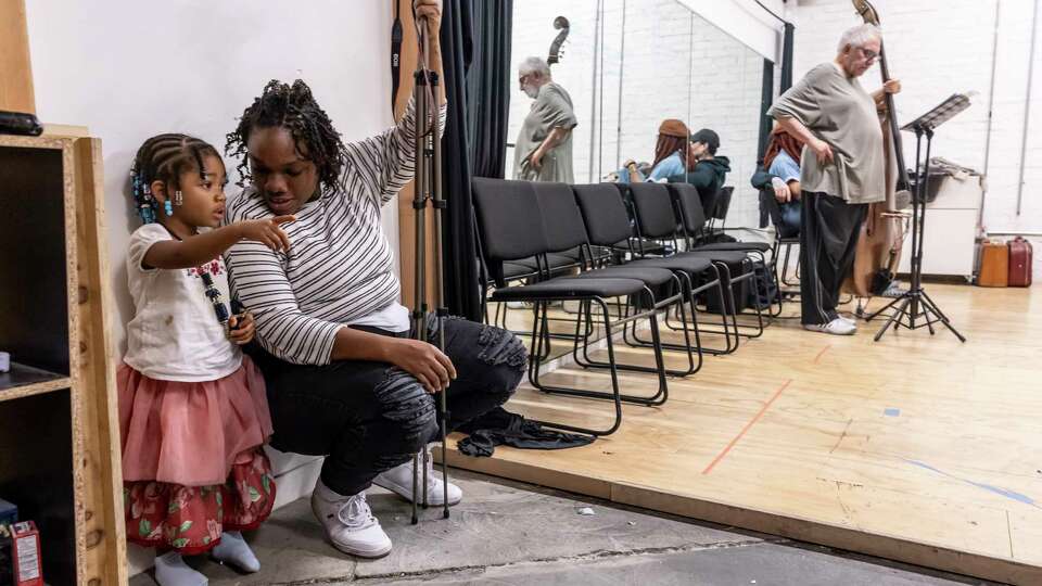 Kimi Harvey-Scott, talks with her daughter, Sage Scott, 2, during rehearsal for “A Thousand Ships” by Oakland Theater Project, in Oakland, Calif., on Wednesday, December 4, 2024. As the Bay Area theater scene has shrunken recenlty, Oakland Theater Project has bucked that trend.