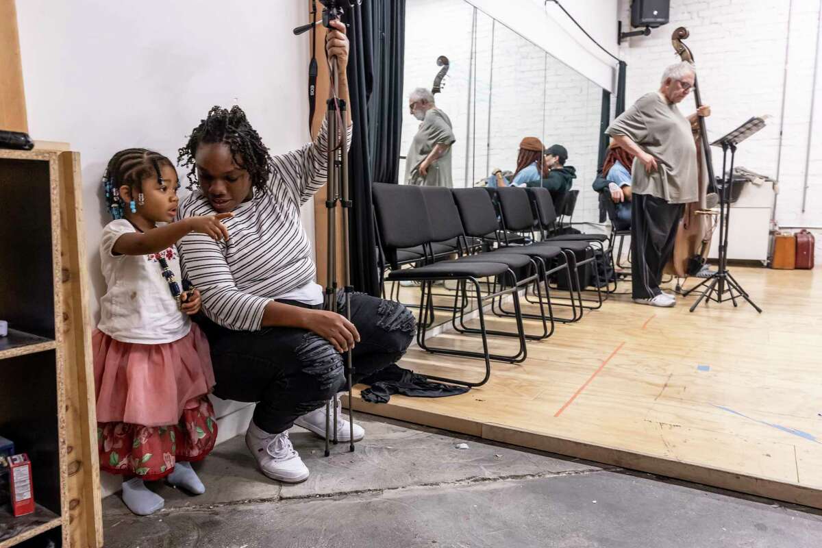 Kimi Harvey-Scott, talks with her daughter, Sage Scott, 2, during rehearsal for “A Thousand Ships” by Oakland Theater Project, in Oakland, Calif., on Wednesday, December 4, 2024. As the Bay Area theater scene has shrunken recenlty, Oakland Theater Project has bucked that trend.