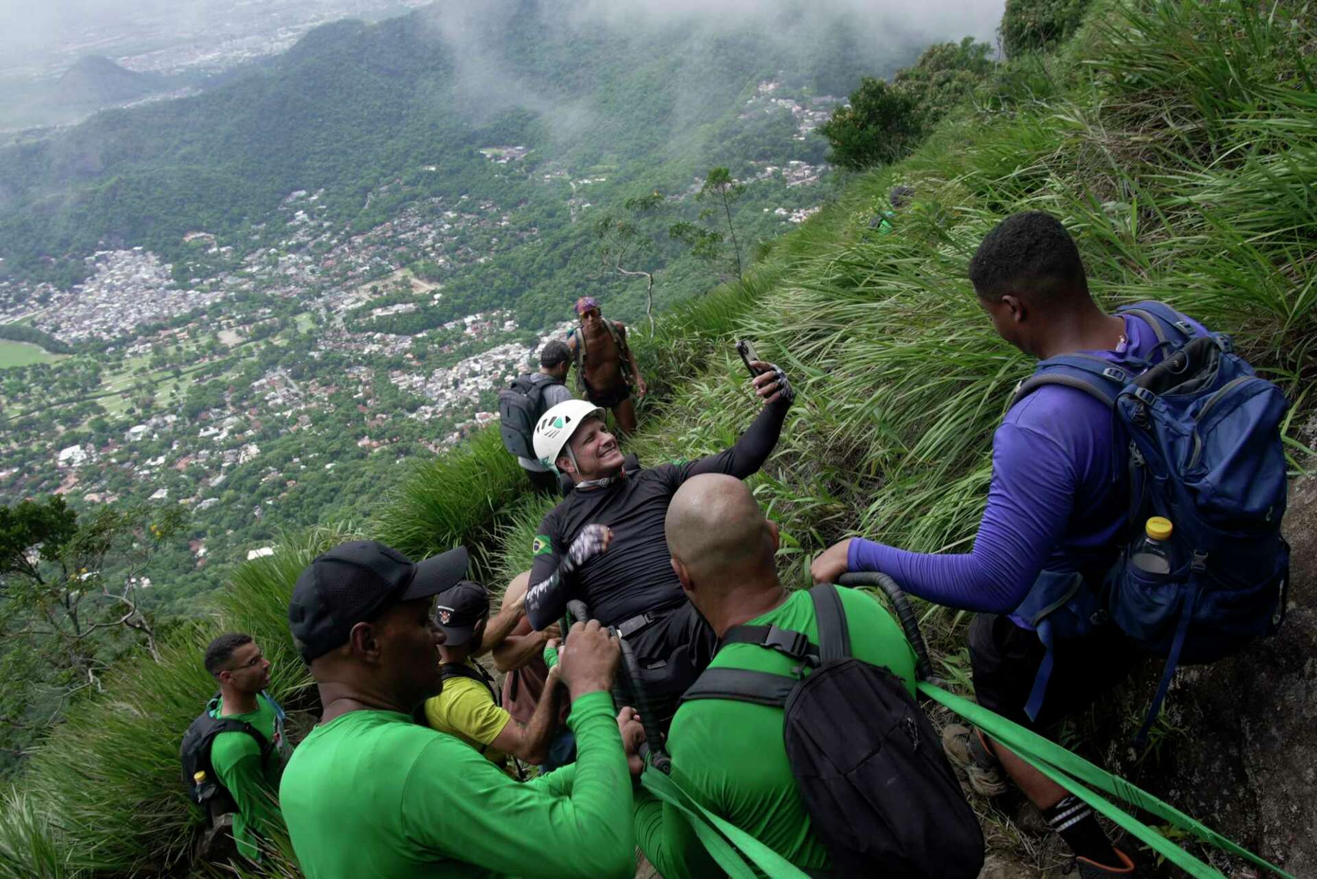 A Paraplegic Man In Brazil Is Lifted Into The Clouds On One Of Rio De ...