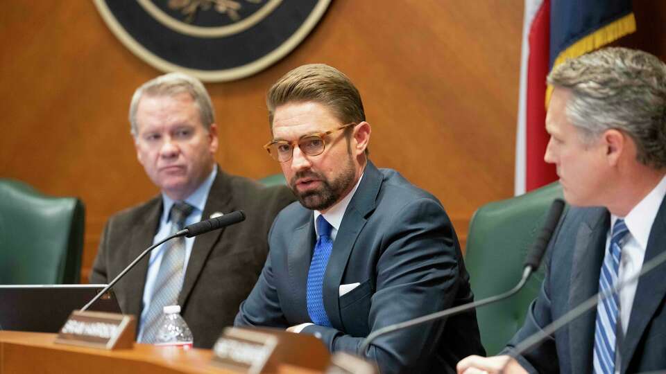 State Reps. David Cook, Jeff Leach and Brian Harrison listen as the House Criminal Jurisprudence Committee meets Friday, December 20, 2024 to take testimony from former airline pilot Josh Burns who was wrongly convicted of 'shaken baby syndrome' in 2015 and later exonerated. Texas Attorney General Ken Paxton again blocked the testimony of Robert Roberson in a similar case.