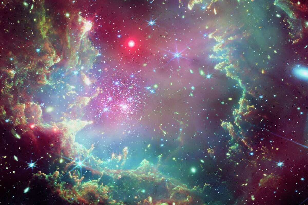 NASA has released images two star clusters that resemble a cosmic wreath and a Christmas tree. 