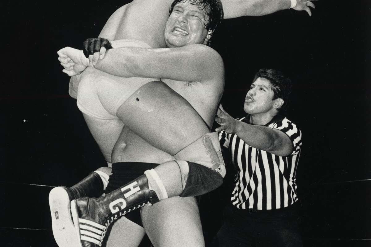 During a June 1985 match, the hated Ted DiBiase locks Hector Guerrero in a hold. Guerrero was part of the celebrated Guerrero wrestling family of El Paso. DiBiase would soon join the World Wrestling Federation to become The Million Dollar Man.