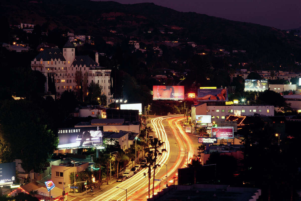 An aerial view of Sunset Boulevard in Los Angeles at dusk.