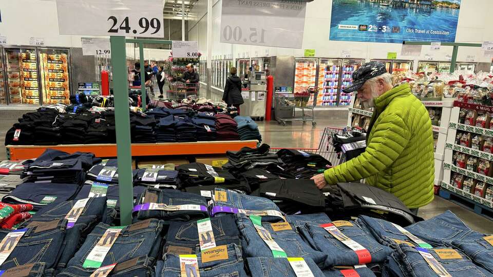 NOVATO, CALIFORNIA - DECEMBER 11: A customer shops for clothing at a Costco store on December 11, 2024 in Novato, California. According to a Bureau of Labor Statistics report, the consumer price index increased 0.3 percent to a 12-month inflation rate of 2.7 percent in November, 0.1 percentage point higher than October.