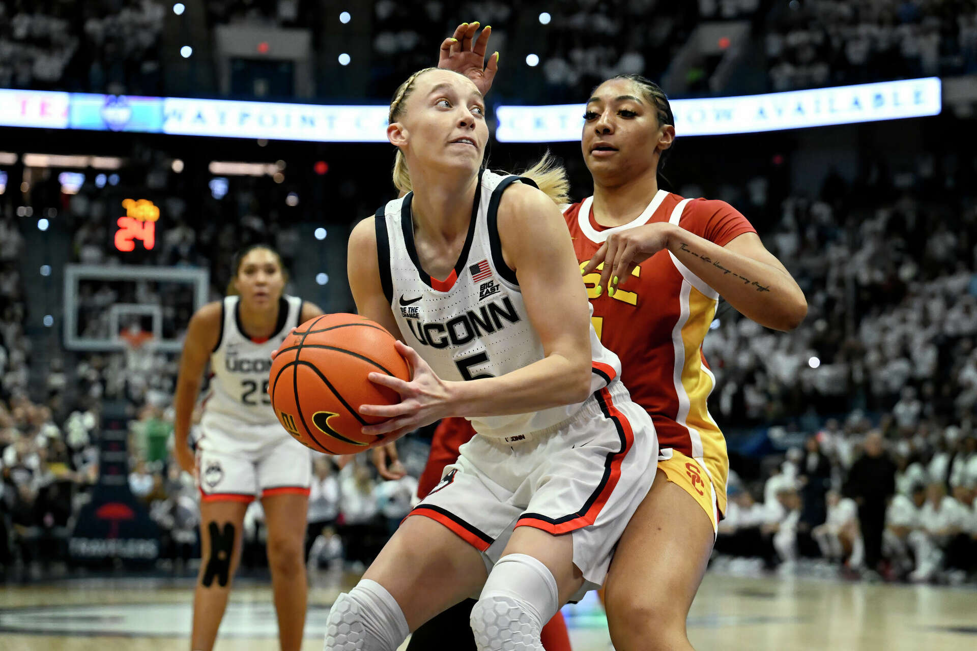 UConn, USC wearing sneakers with slogan from Sue Bird's brand