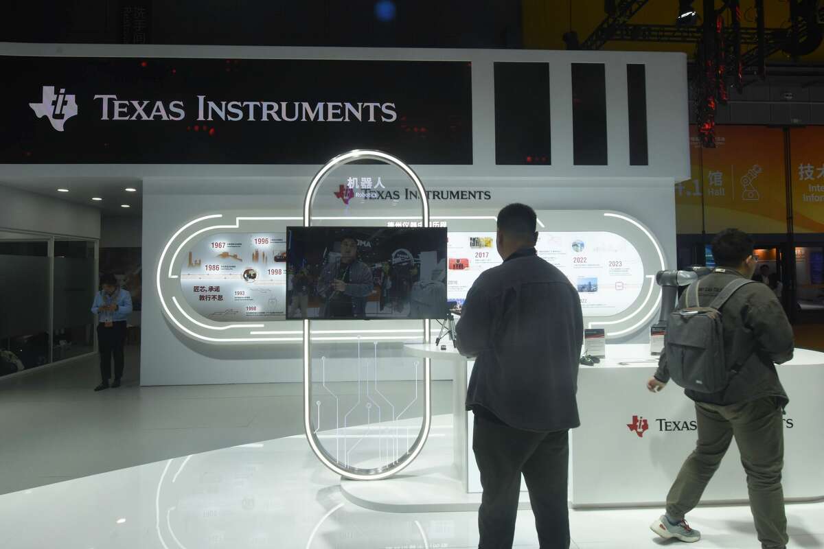 Visitors are visiting various integrated circuit chips developed and produced by Texas Instruments at the 6th China International Import Expo (CIIE) in Shanghai, China, on November 6, 2023. (Photo by Costfoto/NurPhoto via Getty Images)