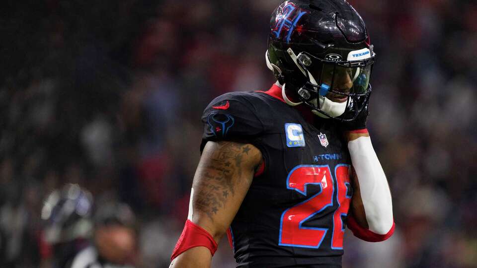 Houston Texans running back Joe Mixon (28) walks off the field after coming up short on fourth down, one yard from the goal line during the first half of an NFL football game, Wednesday, Dec. 25, 2024, in Houston.