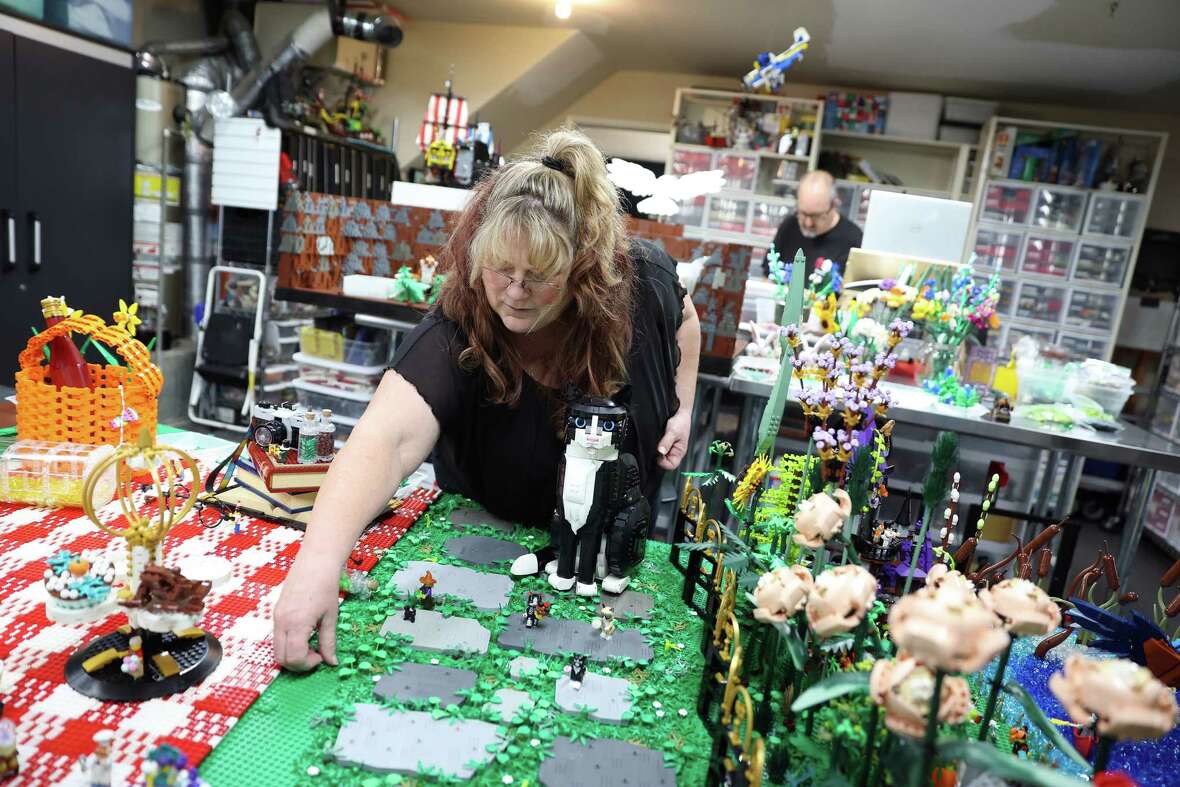 Colleen and Dan Kees work on their Halloween Lego display in their Lego lab in their garage in San Jose on Sunday, October 27, 2024.